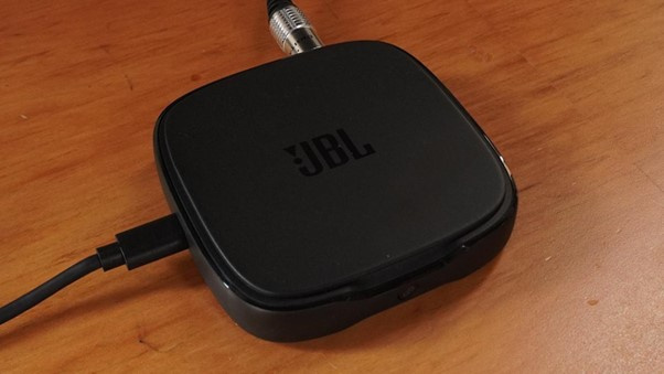 The One Commander acts as a wireless bridge between the TV and the system, making cable management much easier compared to running everything directly into the soundbar.