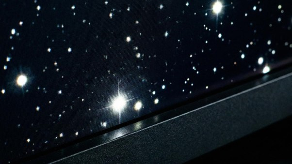 HDR lets tiny bright highlights pop against truly deep blacks, revealing detail in starfields that SDR would turn into a muddy grey.