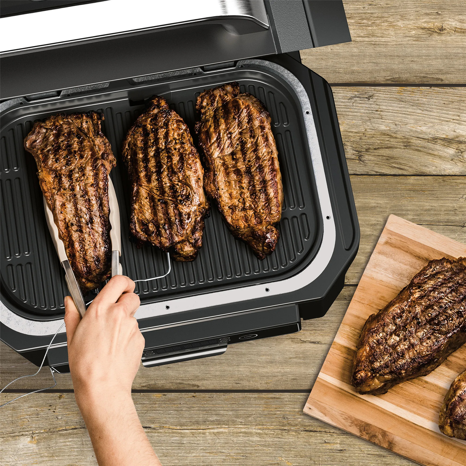 Ninja OG850 Woodfire pro XL Outdoor Electric BBQ Grill & Smoker with smart Probe, Master Grill, BBQ Smoker, & Air Fryer with 100% real authentic woodfire flavour. 4-in-1 Functionality, 30% More Capacity